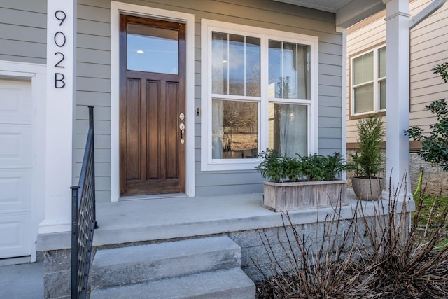 view of exterior entry featuring a porch