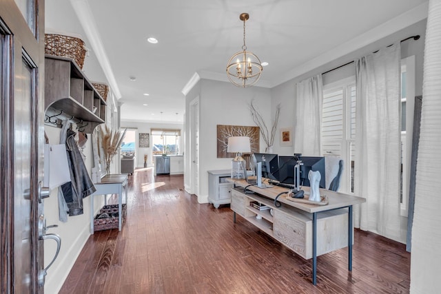 entrance foyer featuring a chandelier, dark hardwood / wood-style flooring, and ornamental molding