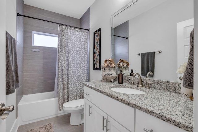 full bathroom featuring vanity, shower / bath combination with curtain, and toilet