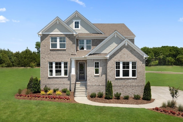 craftsman-style house with a front lawn