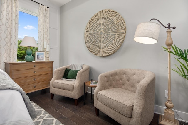 bedroom with dark wood-type flooring