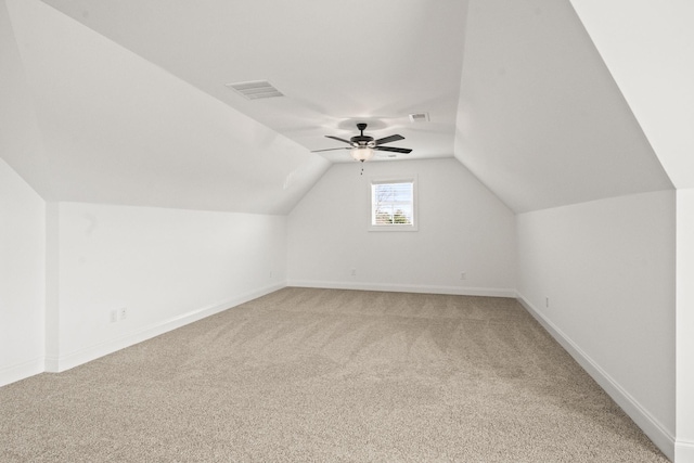 bonus room with carpet, ceiling fan, and vaulted ceiling