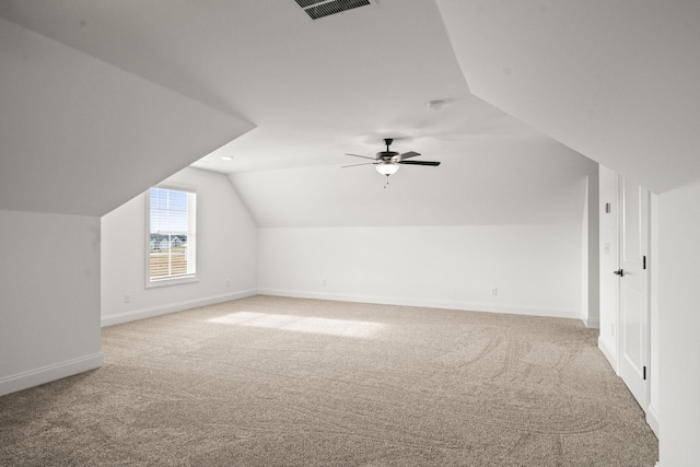 additional living space with carpet, ceiling fan, and lofted ceiling