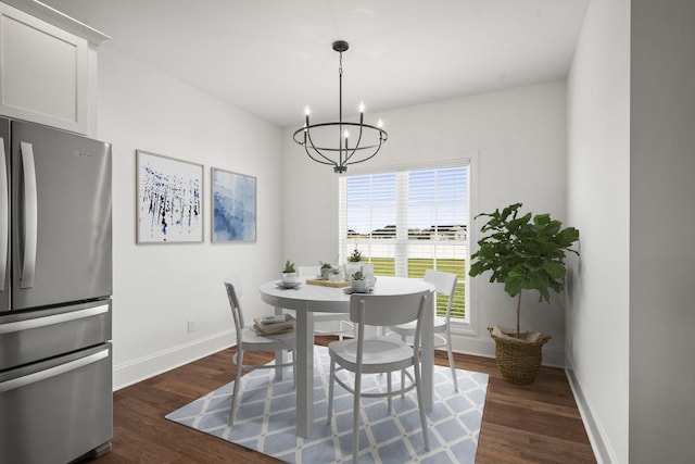 dining area with a chandelier, dark hardwood / wood-style flooring, and a wealth of natural light