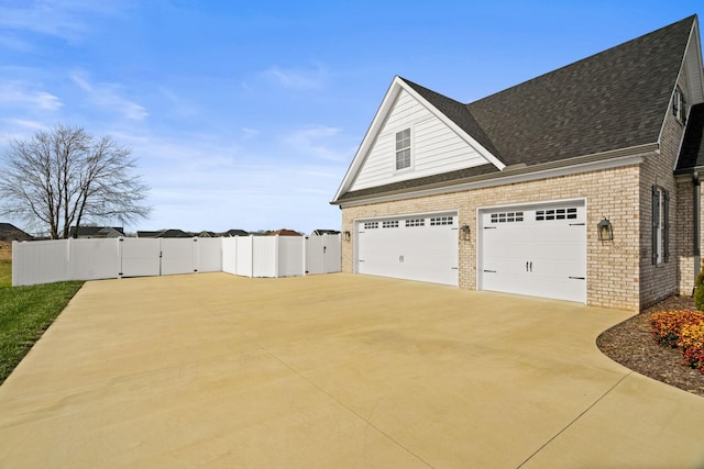 view of side of home with a garage