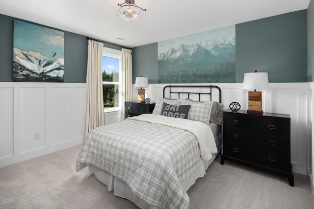 bedroom featuring light colored carpet