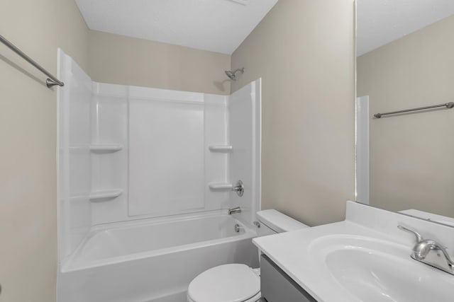 full bathroom with shower / tub combination, vanity, a textured ceiling, and toilet