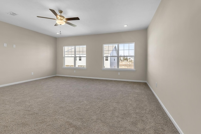 empty room with carpet flooring and ceiling fan