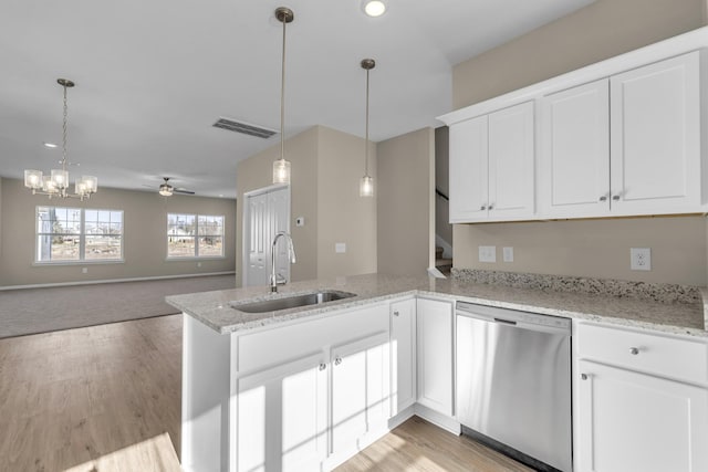 kitchen featuring dishwasher, ceiling fan with notable chandelier, white cabinetry, and sink