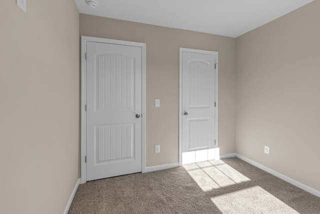 unfurnished bedroom with carpet floors