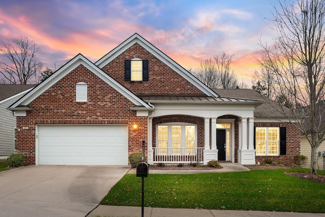 view of front of property with a yard and covered porch