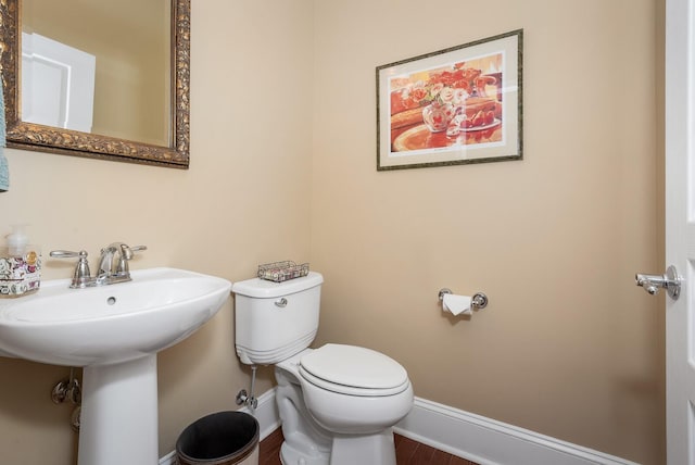 bathroom featuring toilet