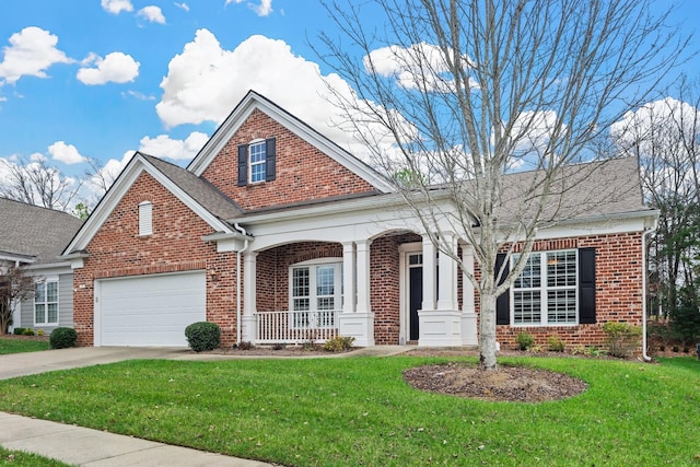 view of front of property with a garage, a porch, and a front yard