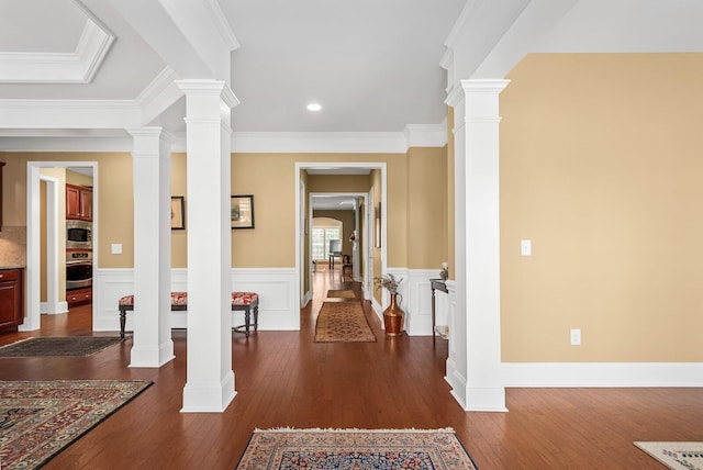 corridor with dark wood-type flooring and ornamental molding