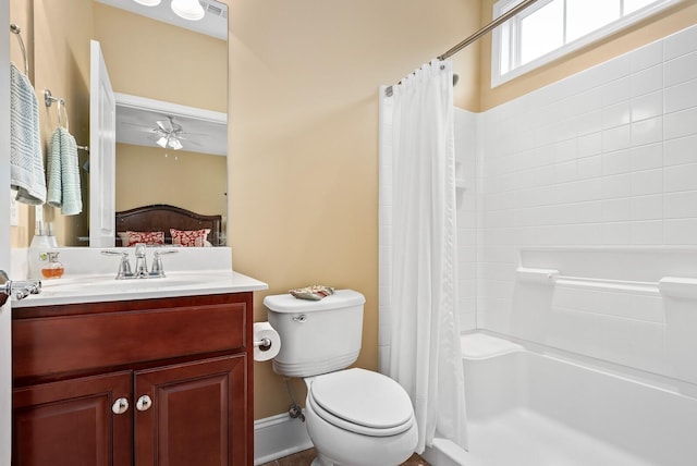 bathroom with vanity, ceiling fan, a shower with shower curtain, and toilet