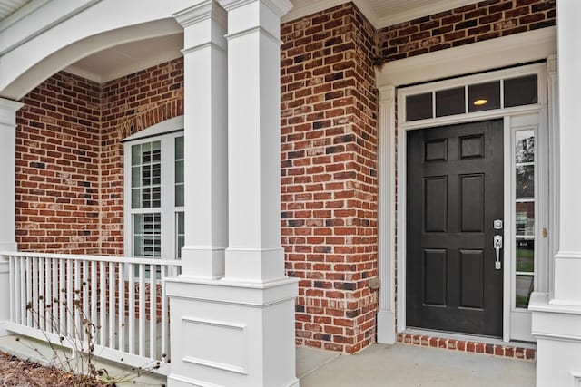 doorway to property with covered porch