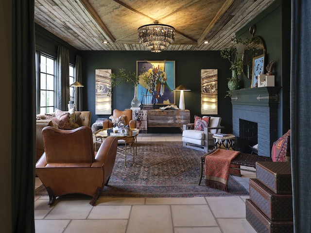 sitting room with an inviting chandelier, a brick fireplace, and wood ceiling