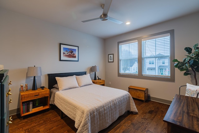 bedroom featuring ceiling fan and dark wood-type flooring