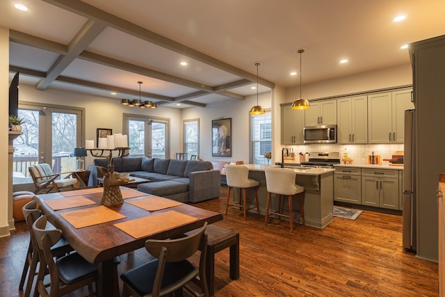 dining area featuring beamed ceiling, french doors, dark hardwood / wood-style floors, and coffered ceiling