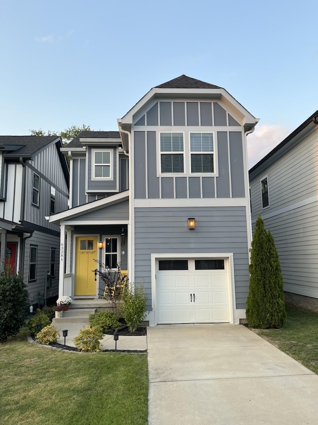 view of front of house featuring a front yard and a garage