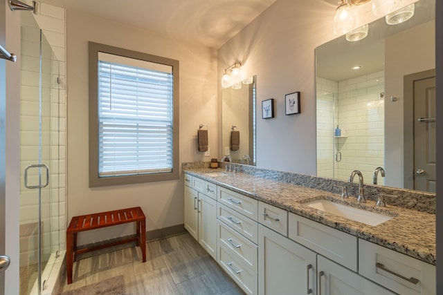 bathroom with vanity and walk in shower