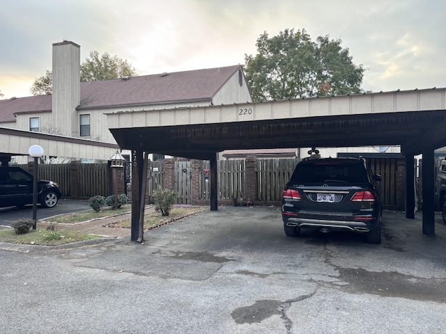 view of vehicle parking featuring a carport