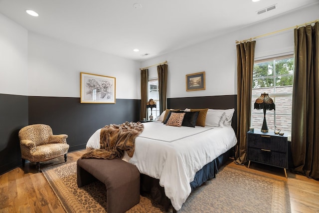 bedroom with hardwood / wood-style flooring