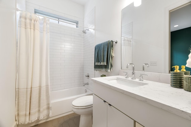 full bathroom featuring tile patterned floors, shower / bath combination with curtain, toilet, and vanity