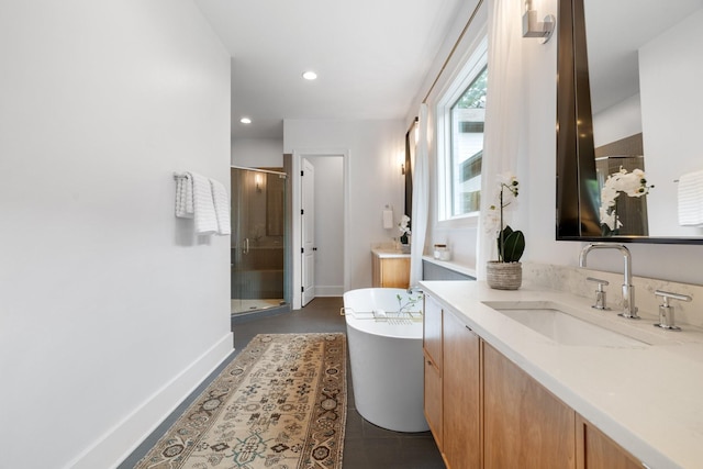 bathroom with tile patterned floors, vanity, and independent shower and bath