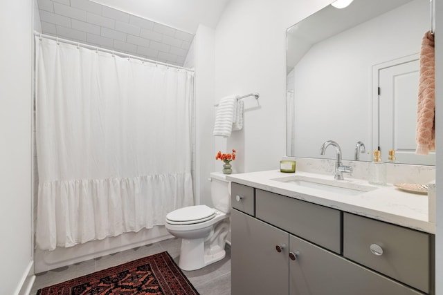 full bathroom with vanity, shower / bath combination with curtain, and toilet