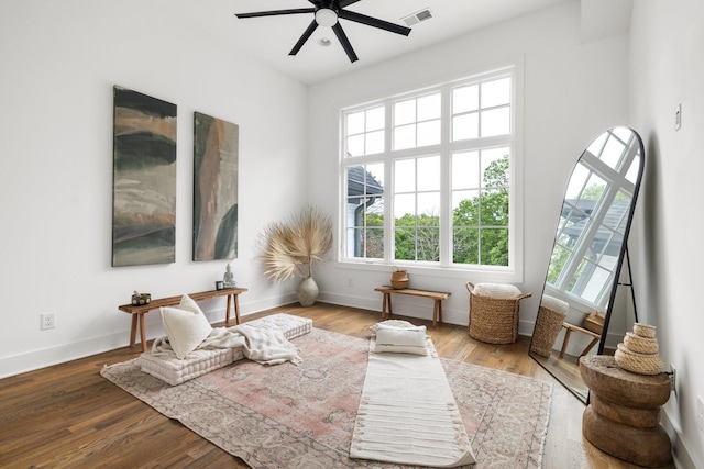 sitting room featuring hardwood / wood-style flooring and ceiling fan