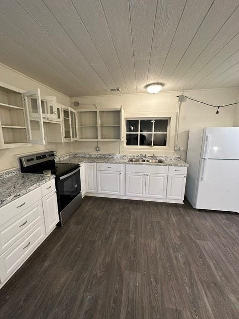 kitchen with sink, dark hardwood / wood-style flooring, white refrigerator, stainless steel electric range, and white cabinets