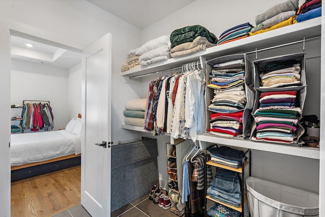 spacious closet with tile patterned floors