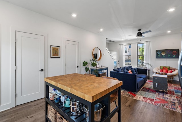 dining area featuring ceiling fan and dark hardwood / wood-style floors