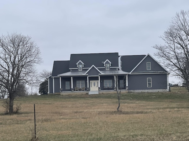 view of front of house with a porch and a front lawn