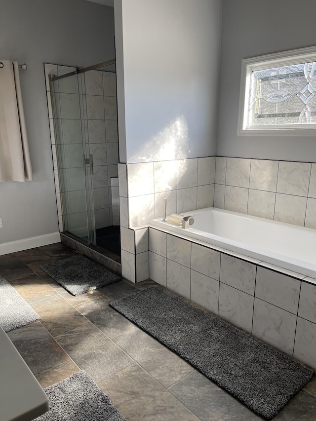 bathroom with shower with separate bathtub