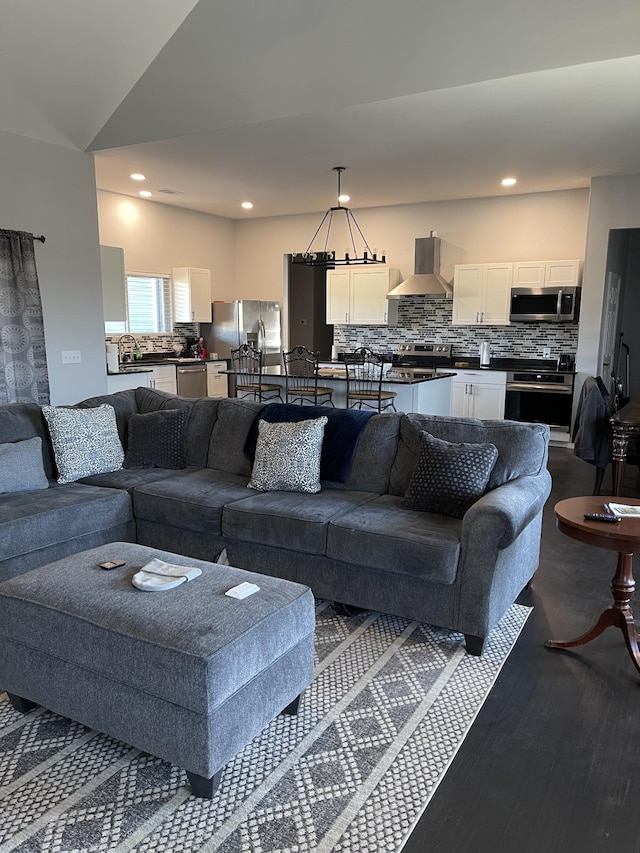 living room with wood-type flooring and lofted ceiling