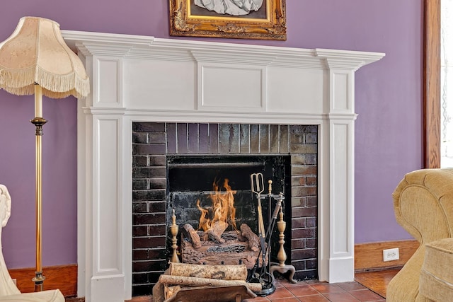 room details featuring a brick fireplace