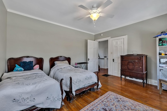 bedroom featuring ceiling fan, crown molding, and hardwood / wood-style flooring