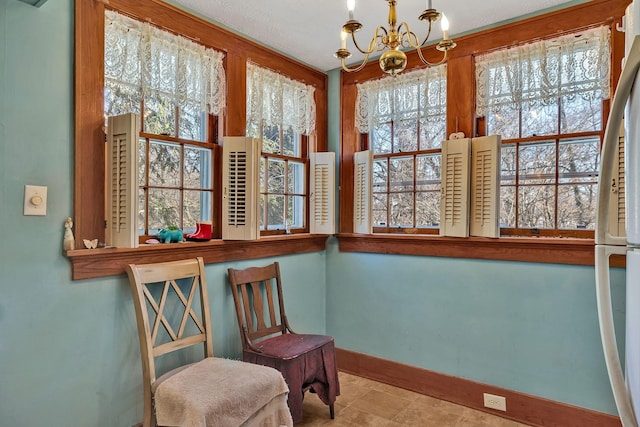 living area with a notable chandelier