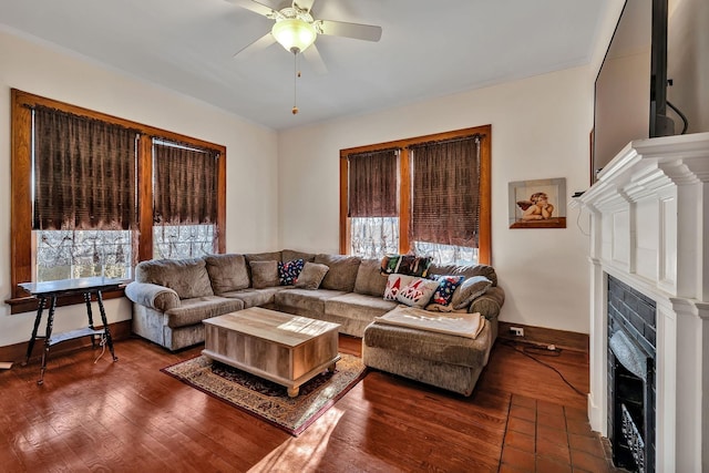 living room featuring ceiling fan and dark wood-type flooring