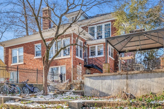 view of side of home with a gazebo