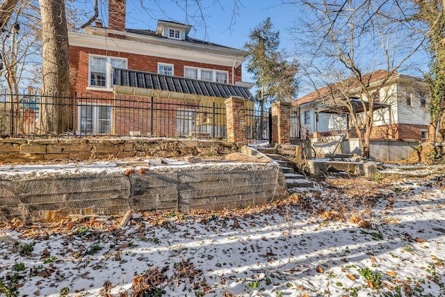 view of snow covered house