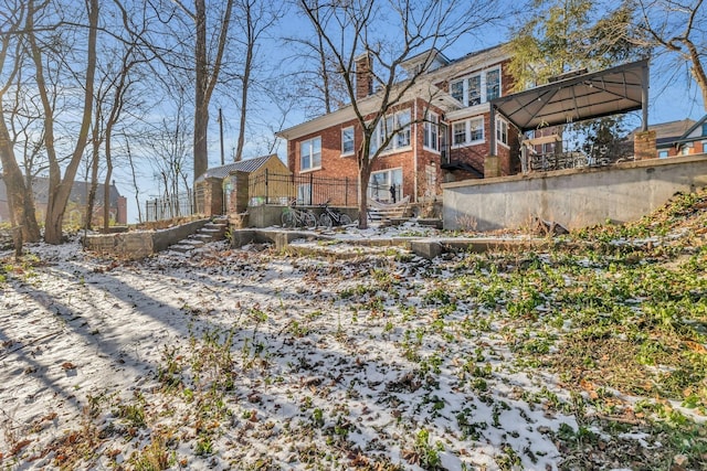 view of snow covered house