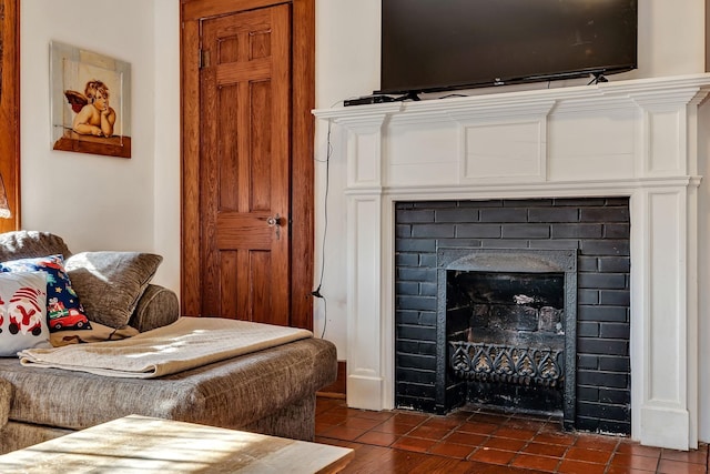 interior space featuring a brick fireplace