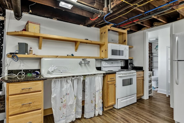 kitchen featuring white appliances and dark wood-type flooring