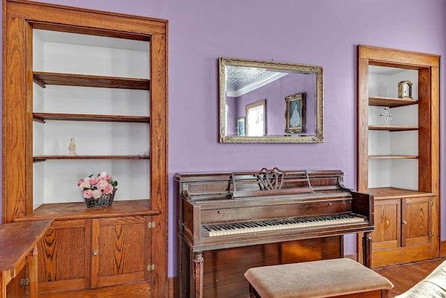 misc room with crown molding and hardwood / wood-style flooring