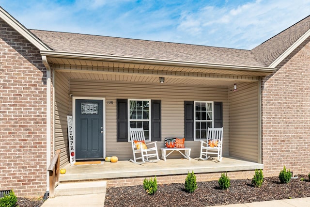 entrance to property featuring covered porch