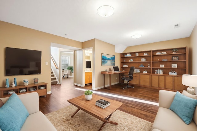 living room with dark hardwood / wood-style floors