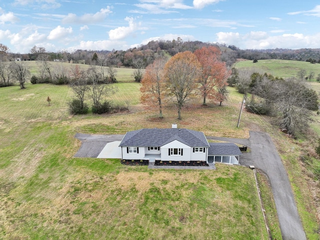 birds eye view of property with a rural view